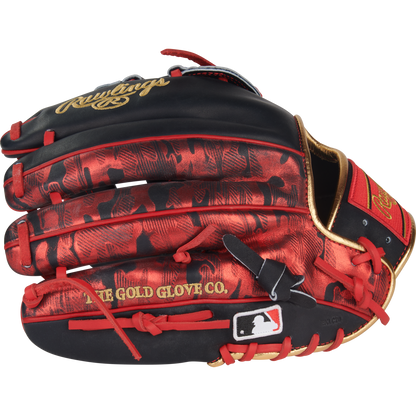 The Rawlings Heart of the Hide 12" Nolan Arenado Game Model Glove (PRORNA28N) features a black and red design with gold accents, red laces, "THE GOLD GLOVE CO." and Rawlings text, plus an MLB logo patch near the wrist opening.