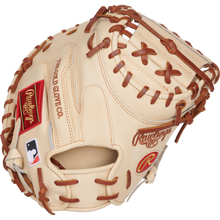 The Rawlings Heart of the Hide 34" Yadier Molina Baseball Catcher's Mitt (PRORYM4C) is a tan mitt with brown laces, red and gold logos, and an MLB patch, displayed on a plain white background.
