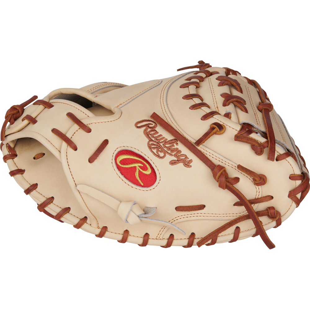 The Rawlings Heart of the Hide 34" Yadier Molina Catcher's Mitt (PRORYM4C) features a tan design with brown lacing and a red Rawlings logo, shown at an angle to highlight the glove’s pocket and detailed stitching.