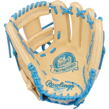 The Rawlings Pro Preferred 11.5" Baseball Glove (PROS204-2CCB) is made from premium tan kip leather with blue laces and blue Rawlings branding on the palm, shown open with the inner side facing forward.