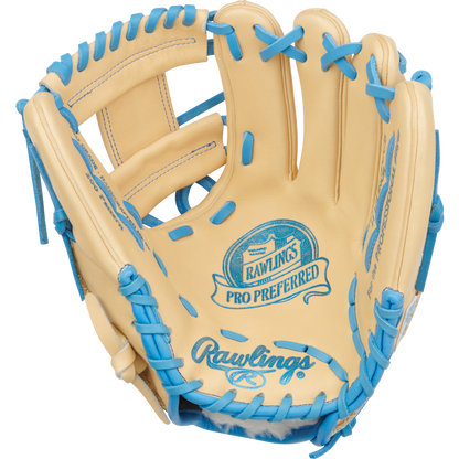 The Rawlings Pro Preferred 11.5" Baseball Glove (PROS204-2CCB) is made from premium tan kip leather with blue laces and blue Rawlings branding on the palm, shown open with the inner side facing forward.
