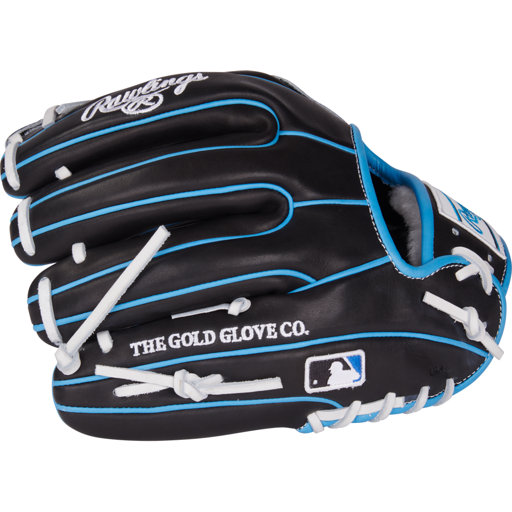 The Rawlings Pro Preferred 11.5" PROS934-2BW Baseball Glove is crafted from black kip leather with blue accents and white laces, and features “THE GOLD GLOVE CO.” and the MLB logo printed on the side.