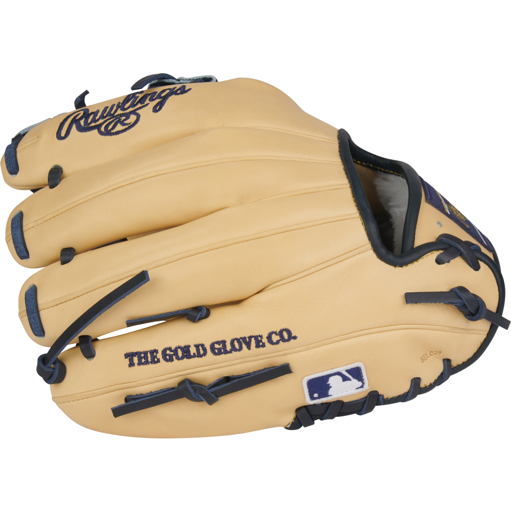 The Rawlings Pro Preferred 11.5" Anthony Volpe Game Model Baseball Glove (PROSAV11) is tan with dark blue laces, THE GOLD GLOVE CO. text, and an MLB logo patch on the thumb.