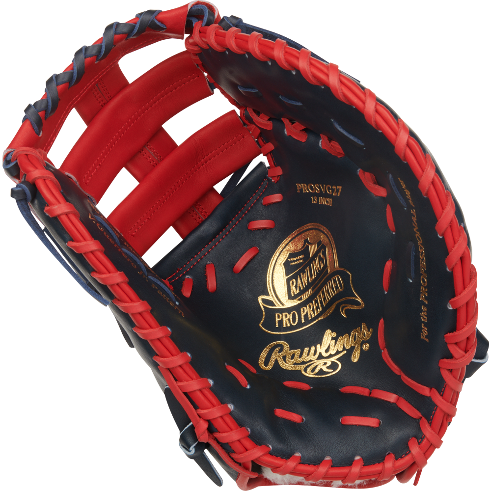 A close-up of the Rawlings Pro Preferred 13" Vladimir Guerrero JR Gameday First Base Mitt (PROSVG27), featuring red lacing and trim, dark blue leather, and gold branding on the palm.