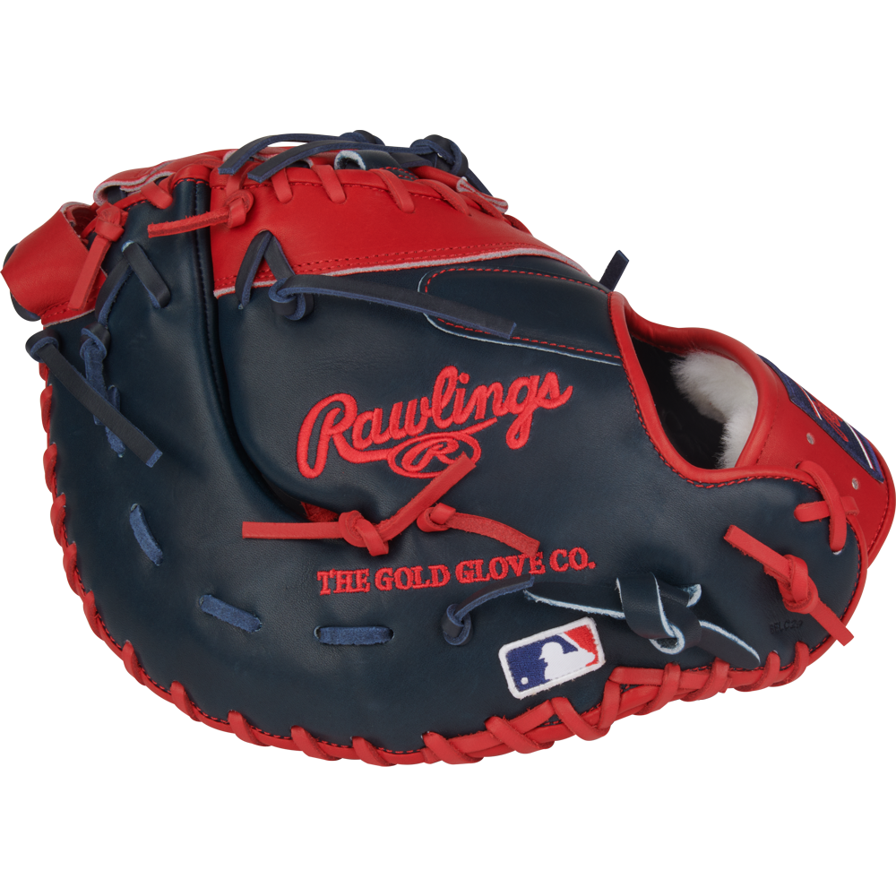 The Rawlings Pro Preferred 13" Vladimir Guerrero JR Gameday First Base Mitt (PROSVG27) features navy and red kip leather, red laces, the Rawlings logo, THE GOLD GLOVE CO. text, and an MLB logo patch on the wrist.
