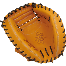 The Rawlings Heart of the Hide 33" Baseball Catcher's Mitt (RPROTCM33T) features tan leather, black lacing, and visible stitching on the palm and fingers.