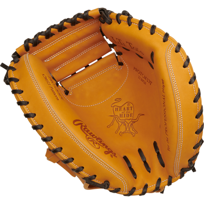 The Rawlings Heart of the Hide 33" Baseball Catcher's Mitt (RPROTCM33T) features tan leather, black lacing, and visible stitching on the palm and fingers.