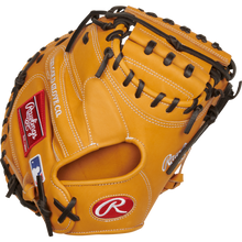 The Rawlings Heart of the Hide 33" Catcher's Mitt (RPROTCM33T) features a tan design with black laces, red and white Rawlings logos, and a white-stitched MLB logo on the wrist.