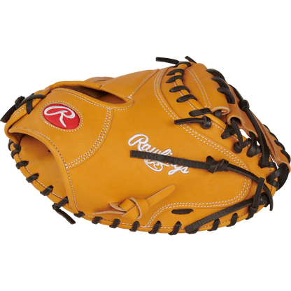 A tan Rawlings Heart of the Hide 33" catcher's mitt (RPROTCM33T) features black laces and white/red embroidered logos.