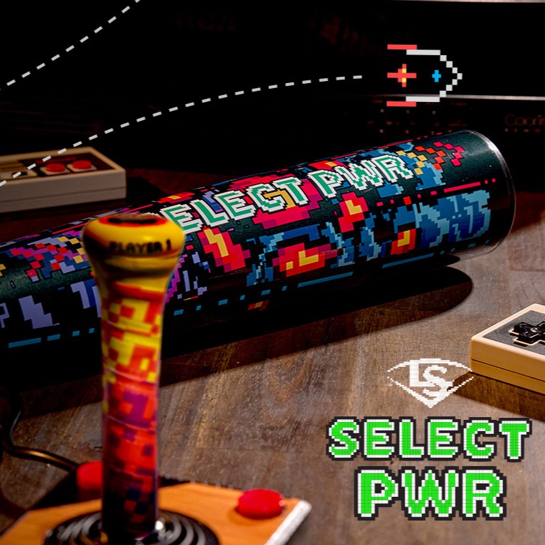 A vibrant Louisville Slugger Select PWR Player 1 (-3) BBCOR Baseball Bat (WBL4182010) sits on a table with retro controllers and 8-bit graphics—"SELECT PWR" and a pixel spaceship—ideal for power hitters.