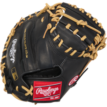 The Rawlings R9 32" ContoUR Baseball Catcher's Mitt (R9CMU-23BC) features a black design with tan laces, a red Rawlings wrist patch, and "The Gold Glove Co." embroidered in gold—ideal for aspiring youth catchers.