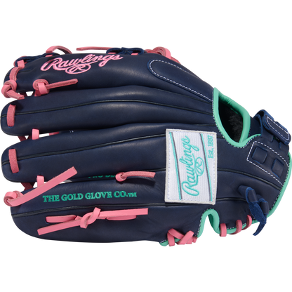 The Rawlings R9 11.5" Fastpitch Glove (R9SB115U-2N) is navy blue with pink laces, teal accents, and white patches showing the Rawlings logo and “The Gold Glove Co.” text in green. The glove's outer side is visible.