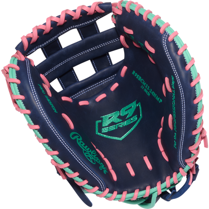 The Rawlings R9 33" Fastpitch Catcher's Mitt (R9SBCM33-24NMP) features navy blue leather with pink and mint lacing, RS Series and green Rawlings logos—an eye-catching softball glove built for elite catchers.