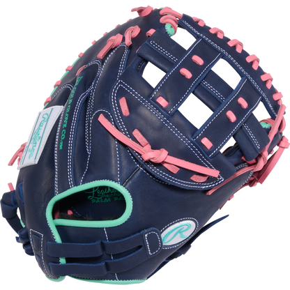 The Rawlings R9 33" Fastpitch Catcher's Mitt (R9SBCM33-24NMP) features navy blue leather, pink laces, teal accents, white stitching, and Rawlings logos on the palm and wrist strap—a standout softball glove.