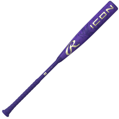 The 2027 Rawlings Icon (-3) BBCOR Baseball Bat (RBB7I3) features a vibrant purple design with the word “ICON” in large white letters near the barrel and a stylized Rawlings “R” logo closer to the handle. This composite bat is equipped with a wrapped grip handle for enhanced comfort and control.