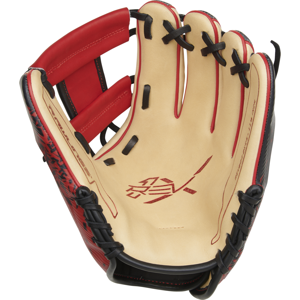 A close-up of the Rawlings REV1X 11.5" Baseball Glove (RREV204-2XCS) shows tan leather on the palm, bold red accents, black laces, and innovative 3D-printed design with logo and text in the center.