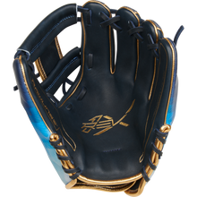 The Rawlings REV1X 11.5" Baseball Glove (RREV204-2XNG) features navy blue and gold colors, blue accents, gold stitching, a stylized gold palm logo, open webbing, and an unused infield design.