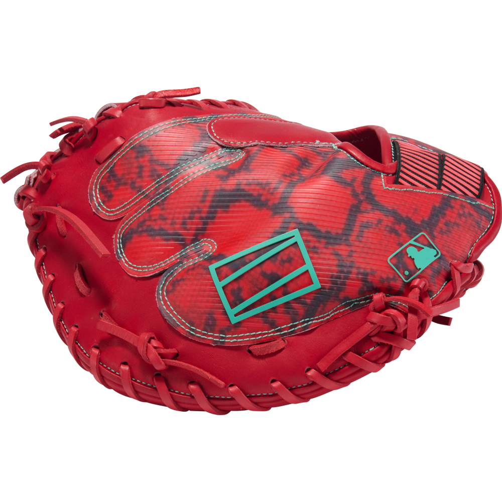 Here is the rewritten sentence using your provided product data: The Rawlings REV1X 34″ Baseball Catcher’s Mitt (REVCM43-23S) by Rawlings stands out with its bold red snakeskin pattern, striking teal accents, and the MLB logo near the base, all set against a clean white background.