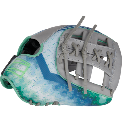 The Rawlings REV1X 11.5" Francisco Lindor GM Baseball Glove (RREVFL12G) features a vibrant blue, green, and white design with gray leather accents, teal stitching, an open web, and decorative laces inspired by Lindor’s style.