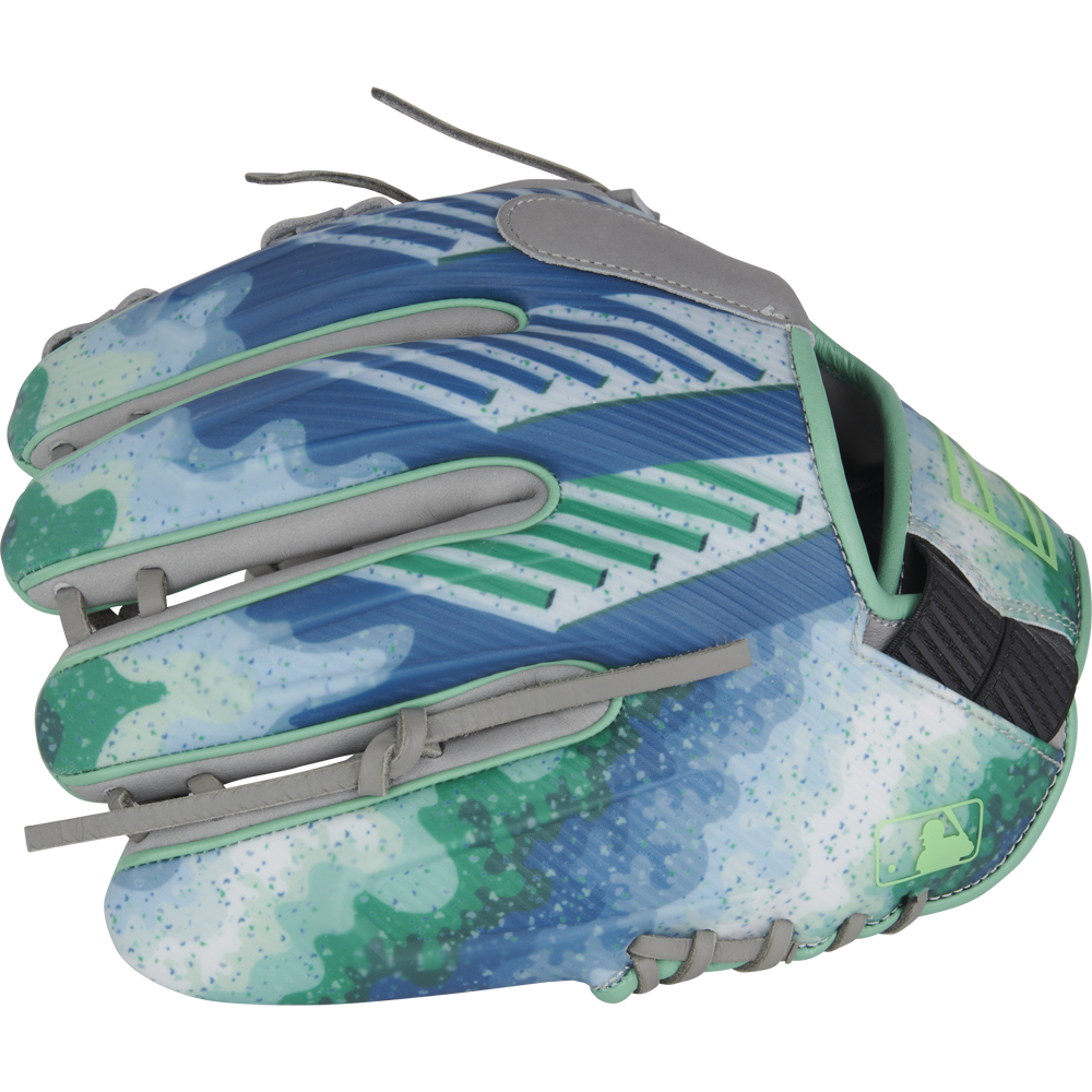 The Rawlings REV1X 11.5" Francisco Lindor GM Baseball Glove (RREVFL12G) sports blue, green, and turquoise abstract patterns, gray laces, a speckled modern design, and a small MLB logo near the wrist.