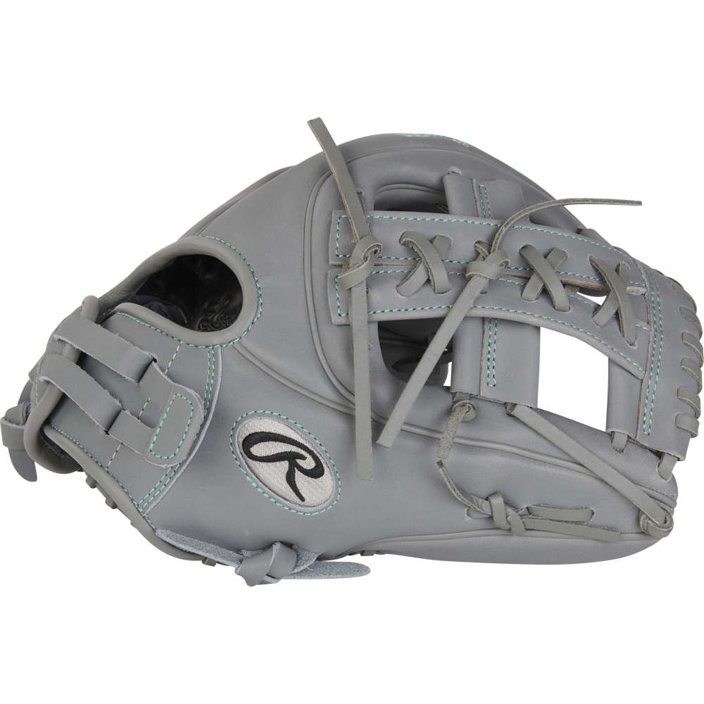 The Rawlings Liberty Advanced 11.75" Fastpitch Softball Glove (RRLA715-32G) is a gray infield glove with teal stitching and laces, made from full-grain leather. It features an open web design and the iconic Rawlings logo on the side.