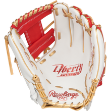 A Rawlings Liberty Advanced Color Sync 11.75" Fastpitch Softball Glove (RLA715SB-2WSG) in white and red with tan laces is open, displaying its palm and signature Rawlings branding inside.