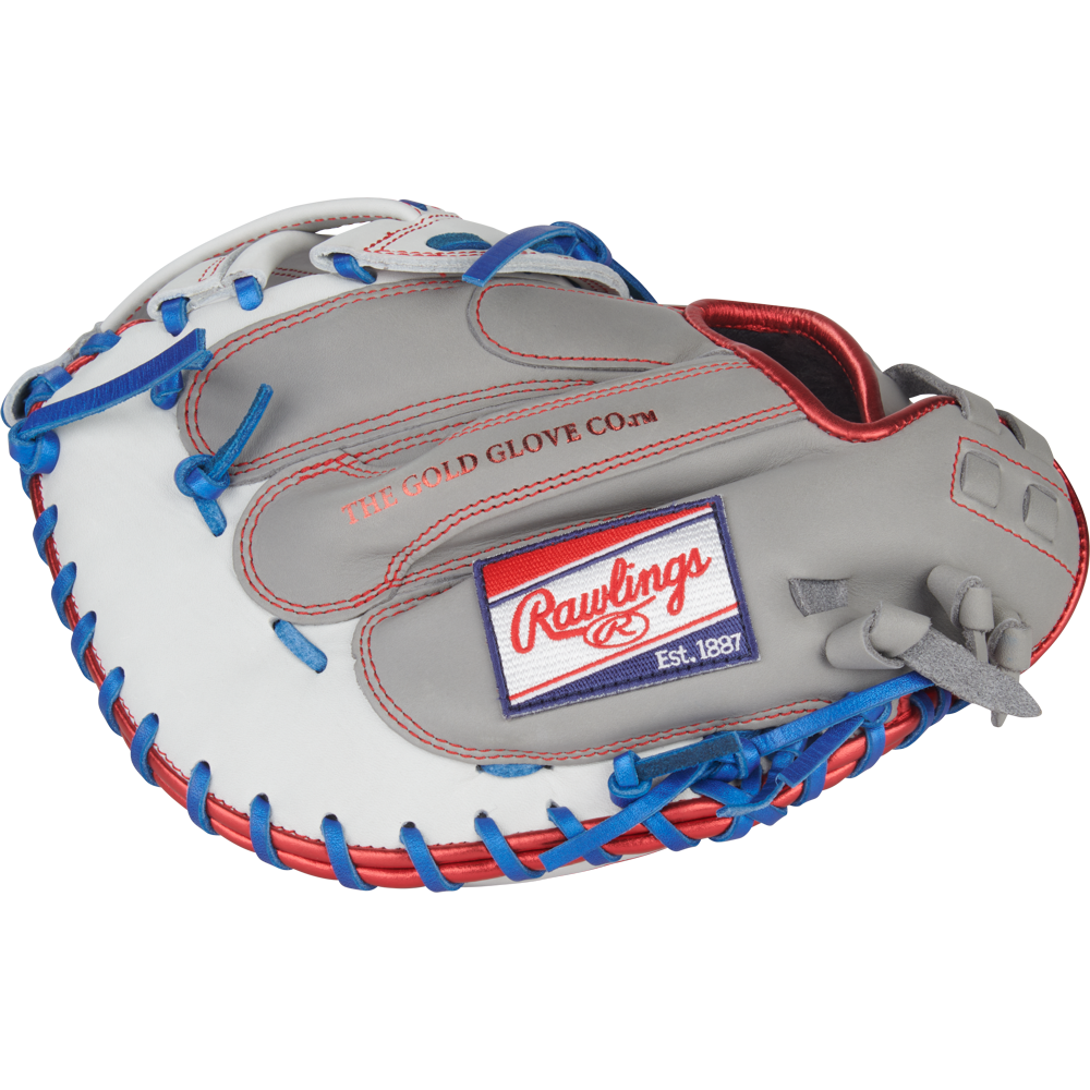 The Rawlings Liberty Advanced 33" Fastpitch Catcher's Mitt (RLACM33FP-24GW) features a gray and white design with blue and red lacing, the Rawlings logo patch, and "THE GOLD GLOVE CO." embossed on the glove.