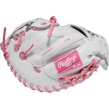 The Rawlings Liberty Advanced 33" Fastpitch Catcher's Mitt (RLACM33FP-24WP) is a white glove with pink laces and accents, featuring the Rawlings logo and THE GOLD GLOVE CO. text in pink—ideal for fastpitch softball catchers.