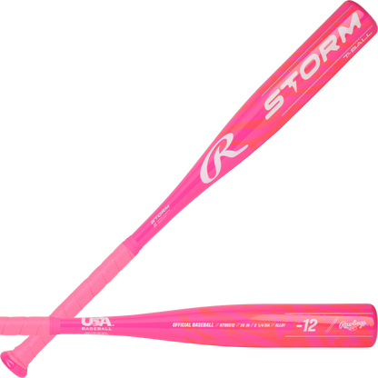 Two bright pink 2025 Rawlings Storm (-12) T-Ball bats are shown, featuring bold white STORM lettering and USA Baseball certification near the handle. Brand: Rawlings. Model: RTB5S12.
