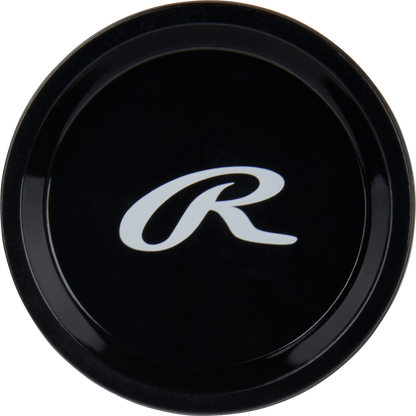 A black circular knob featuring a white stylized R logo, as seen on the 2024 Rawlings Peak (-10) 2 5/8" USA Baseball Bat (RUS4P10), viewed from above against a plain background.