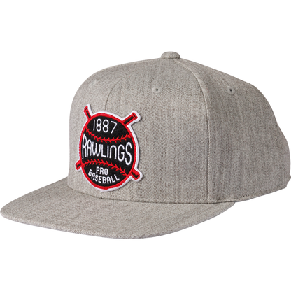 The Rawlings Vintage Flat Bill Snapback Hat (RVBH-HTGY) features a gray design, flat brim, and a round embroidered 1887 Rawlings Pro Baseball patch with crossed red bats—ideal for fans of vintage baseball caps.