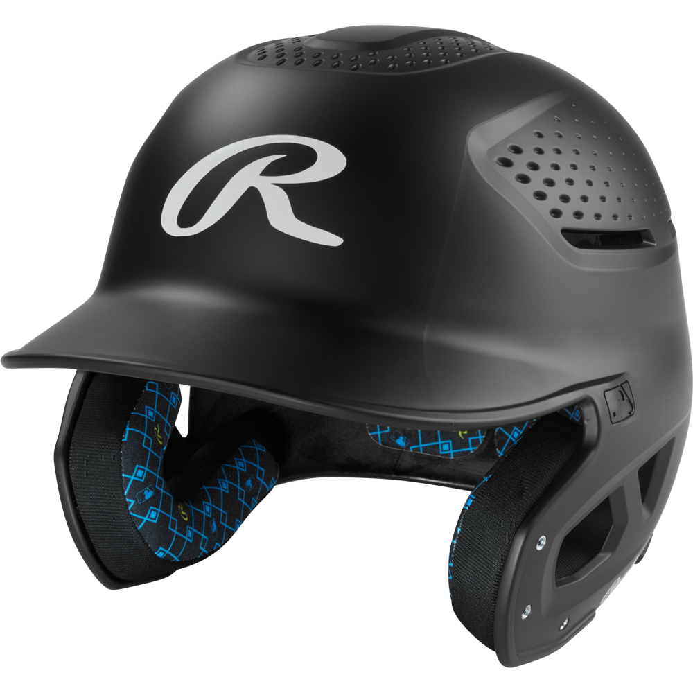 The Rawlings RX2 Matte Batting Helmet: RX2MAT is a matte black youth helmet with ventilation holes, a protective face guard, blue-patterned interior padding, and a large white R logo on the front.