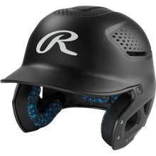 The Rawlings RX2 Matte Batting Helmet: RX2MAT is a matte black youth helmet with ventilation holes, a protective face guard, blue-patterned interior padding, and a large white R logo on the front.