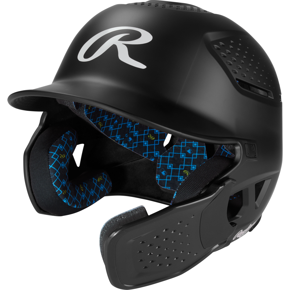 The Rawlings RX2 Reverse Matte Batting Helmet: RX2REVMAT in black features a reversible flap system, protective face guard, blue geometric patterned padding, NOCSAE-certified protection, and a matte finish.