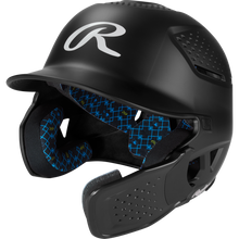 The Rawlings RX2 Reverse Matte Batting Helmet: RX2REVMAT in black features a reversible flap system, protective face guard, blue geometric patterned padding, NOCSAE-certified protection, and a matte finish.