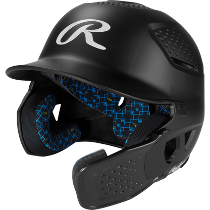 The Rawlings RX2 Reverse Matte Batting Helmet: RX2REVMAT in black features a reversible flap system, protective face guard, blue geometric patterned padding, NOCSAE-certified protection, and a matte finish.