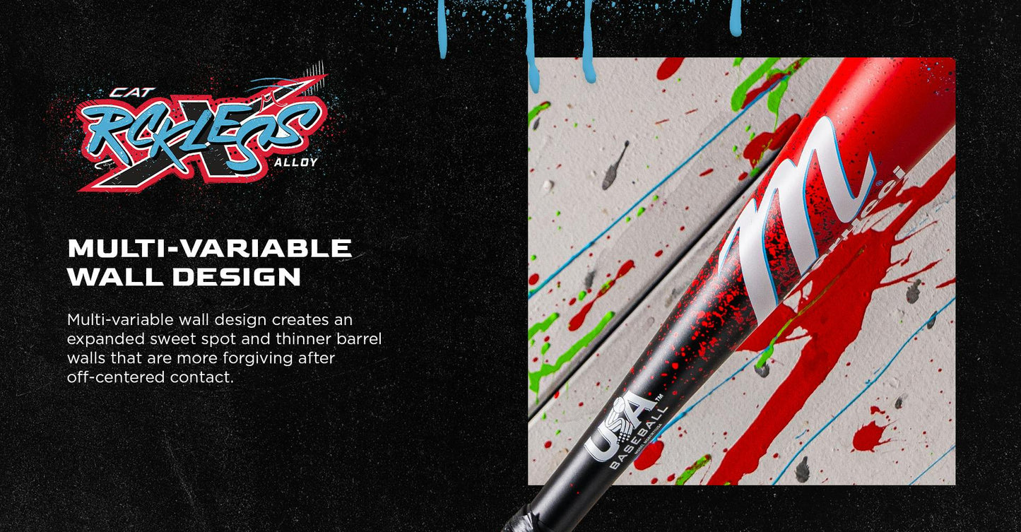 A close-up of the 2026 Marucci CAT X RCKLESS (-8) 2 5/8" USA Baseball Bat (MSBCR8USA) shows its red and black alloy design with white paint splatters on a colorful background, highlighting Marucci’s advanced multi-variable wall construction.