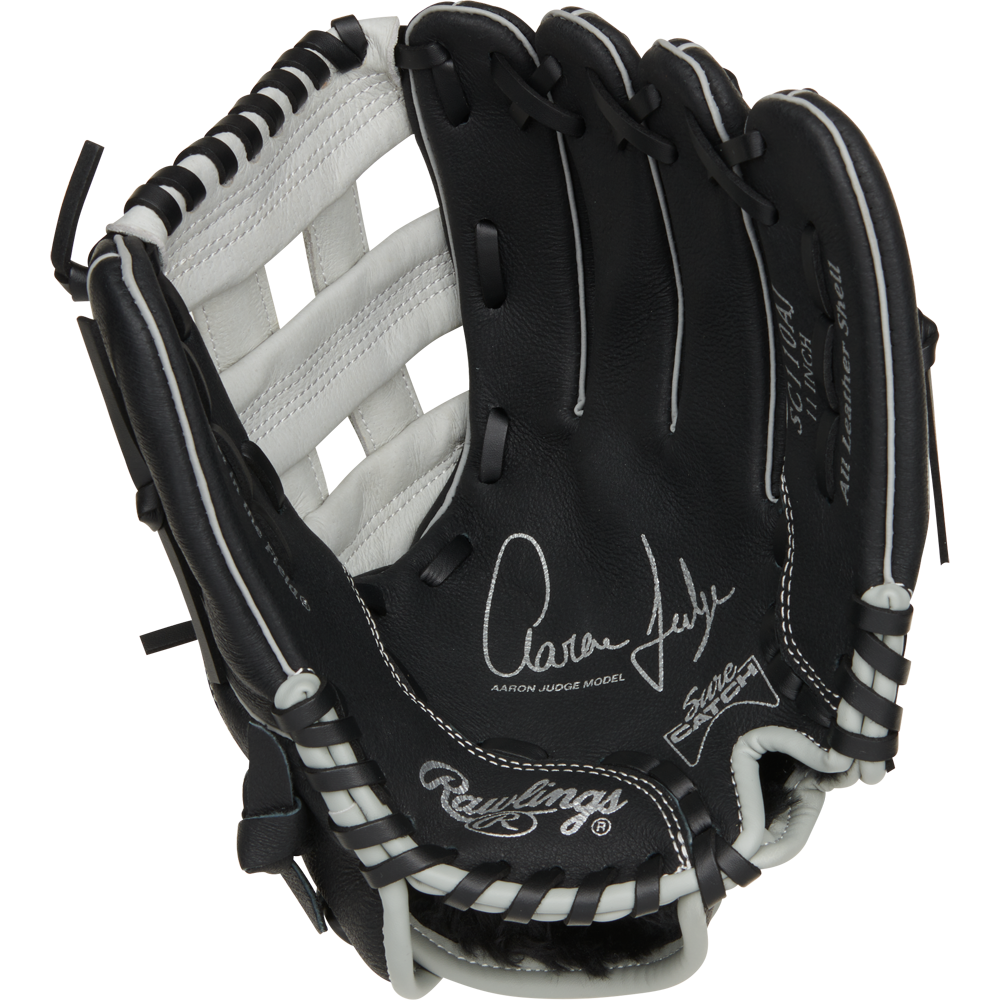 The Rawlings Sure Catch 11" Aaron Judge Youth Baseball Glove (SC110AJ) features a black and white design with white laces and Aaron Judge's signature on the palm.