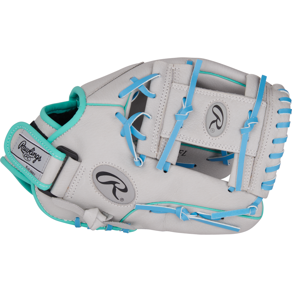 The Rawlings Sure Catch 11.5" Francisco Lindor Youth Baseball Glove (SC115FL) is displayed on a plain light background, featuring a light gray design with teal and blue accents, blue laces, and teal trim.