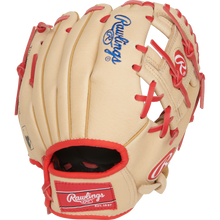 The Rawlings Sure Catch 9.5" Jeremy Pena Youth Baseball Glove (SC950JP) is a tan glove with red laces and trim, blue embroidered Rawlings logo on top, and a red patch on the wrist strap.