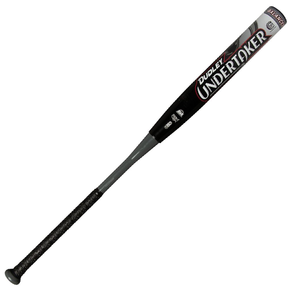 The 2025 Dudley Undertaker 12" Balanced NSA USSSA Slowpitch Softball Bat (UNDERB) features a black and gray design, large white "Undertaker" lettering on the barrel, a textured black grip, and is USSSA-approved.