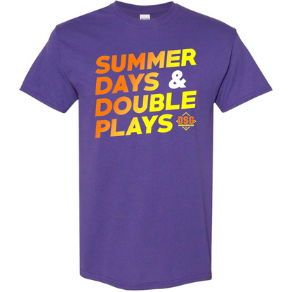 The DSG Apparel Summer Days T-Shirt (DSG-SDDP) features a purple, classic fit with bold yellow, orange, and white "SUMMER DAYS & DOUBLE PLAYS" text and a small DSG logo. Made from soft, pre-shrunk cotton for comfort.