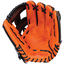 An orange Wilson A2000 1720SS 11.5″ Baseball Glove – GOTM October 2026 (WBG31001RT115) with black laces is displayed open and facing forward, highlighting the inside palm area and intricate stitching. Crafted from durable Pro Stock leather, this special Glove of the Month edition from Wilson stands out for its exceptional quality and eye-catching design.
