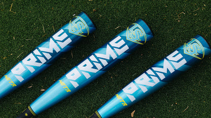 Three 2025 Louisville Slugger Meta Prime (-8) 2 3/4" USSSA Baseball Bats (WBL2971010) with blue, yellow, and white accents are displayed side by side on green artificial turf.