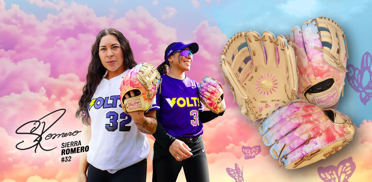 Two smiling female softball players in VOLT team jerseys hold colorful pink and yellow gloves. To the right are close-ups of the gloves. Background features a pink sky with butterflies. Text: SIERRA ROMERO #32 with a signature.