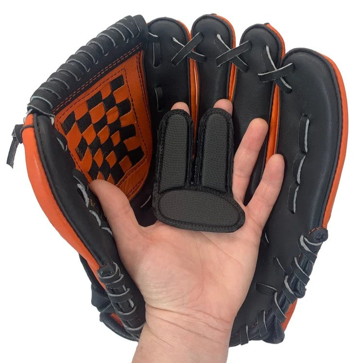 A human hand holds a black and orange baseball glove containing a Markwort PalmGuard Sting Stopper Glove Insert: PAI101 / PYI101.