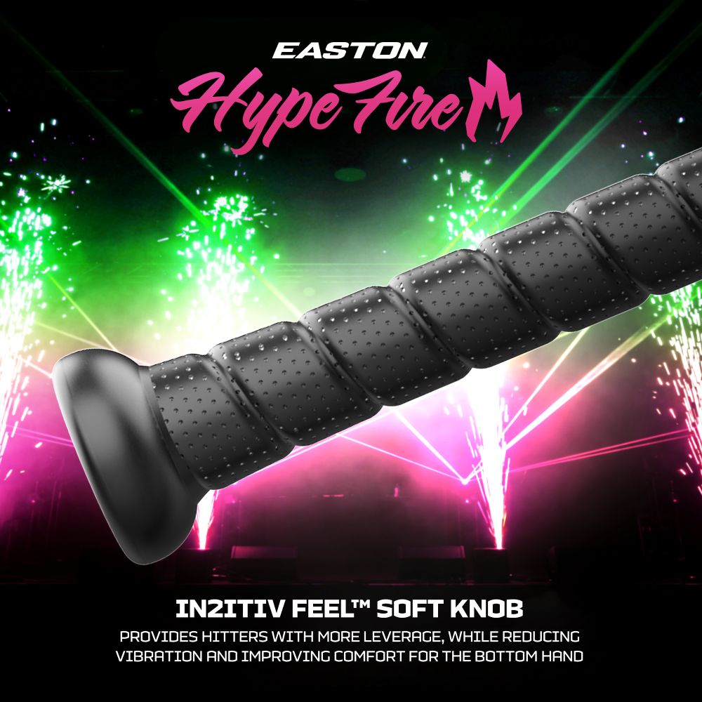 A close-up of a black bat grip displays text: EASTON Hype Fire. IN2ITIV FEEL SOFT KNOB. Incorporating technology from the 2027 Easton Hype Fire (-10) 2 3/4″ USSSA Baseball Bat: EUT7HYP10 by Easton, this grip offers enhanced leverage for hitters, reduces vibration, and improves comfort for the bottom hand. Vibrant fireworks in the background boost its dynamic appeal.