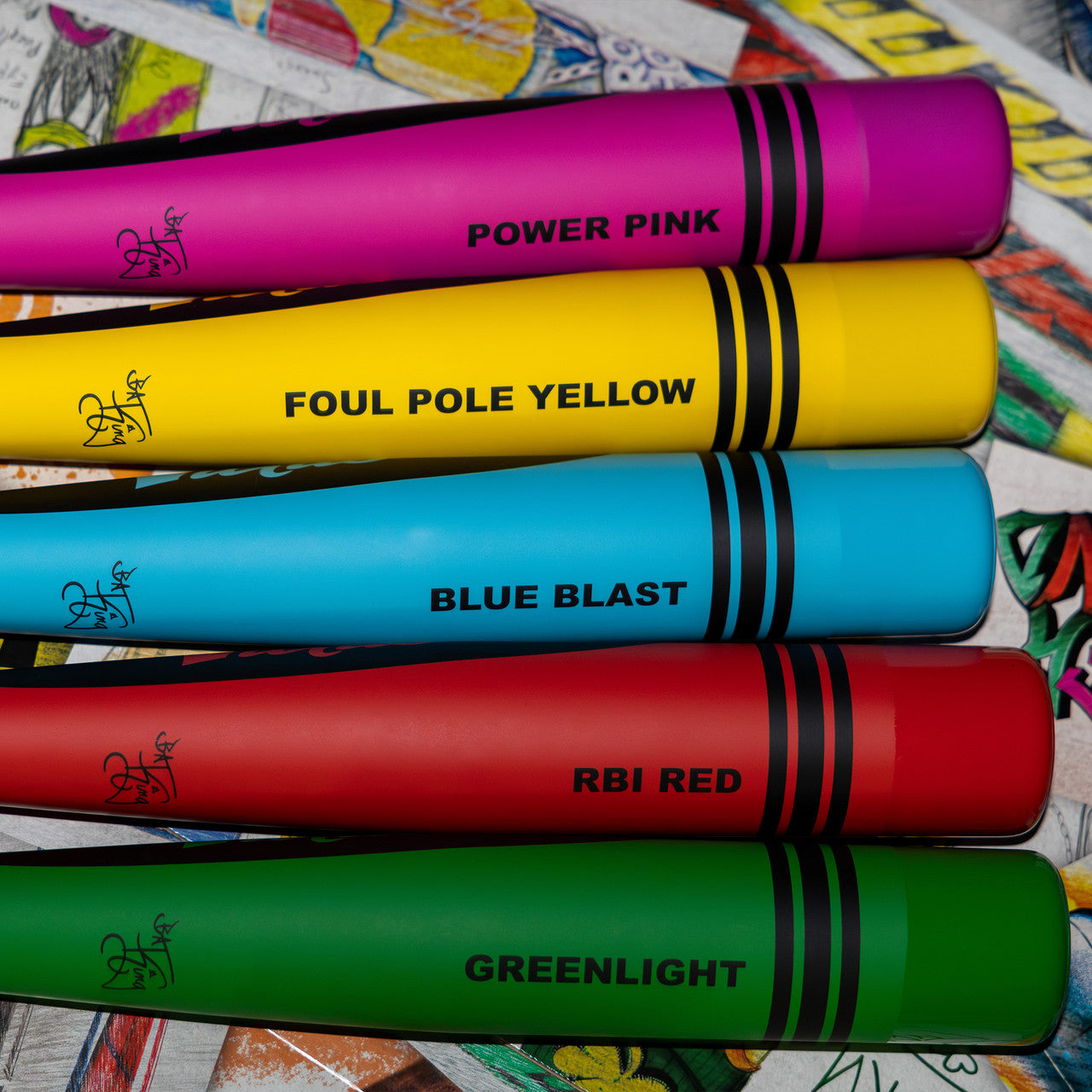 Five vibrant Victus Vibe Crayon (-10) USA Baseball bats are stacked, labeled Power Pink, Foul Pole Yellow, Blue Blast, RBI Red, and Greenlight. Each aluminum bat has black stripes and a vibration-reducing knob.