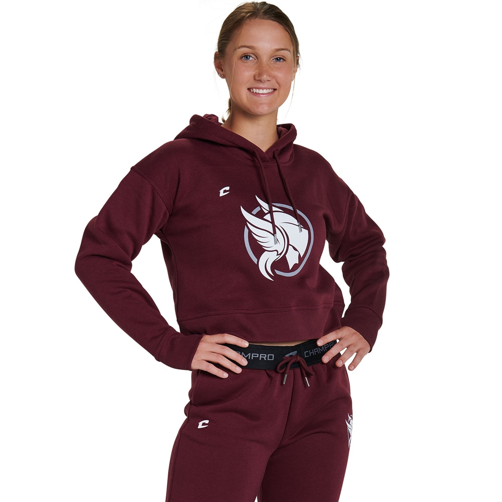 A woman smiles with her hands on her hips, modeling the Champro Sports National Softball Association NSA Home Plate Women's Crop Hoodie in maroon with a white bird logo, paired with matching sweatpants against a white background.