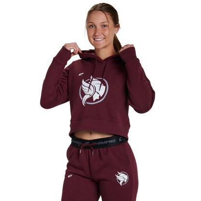 A smiling person wears the Champro Sports National Softball Association NSA Home Plate Women's Crop Hoodie, maroon with a white bull logo, posing against a plain white background.